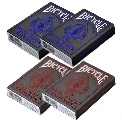 Four decks of Bicycle playing cards, two with red backing and two with blue backing, each featuring a metallic shine and the classic Bicycle logo.