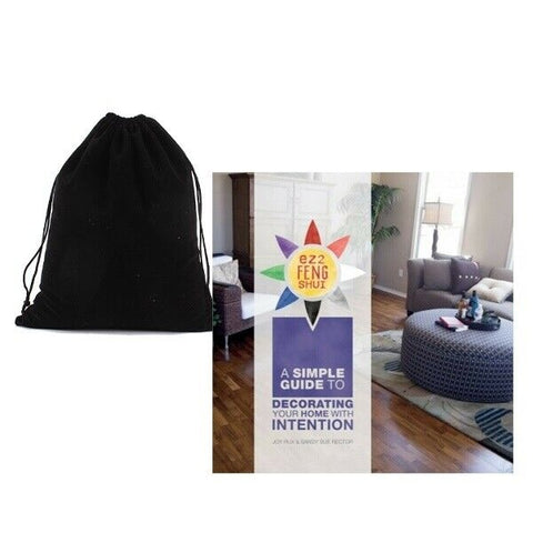 A black drawstring bag is shown on the left, and a book cover titled 'A Simple Guide to Decorating Your Home with Intention' is shown on the right against a white background.
